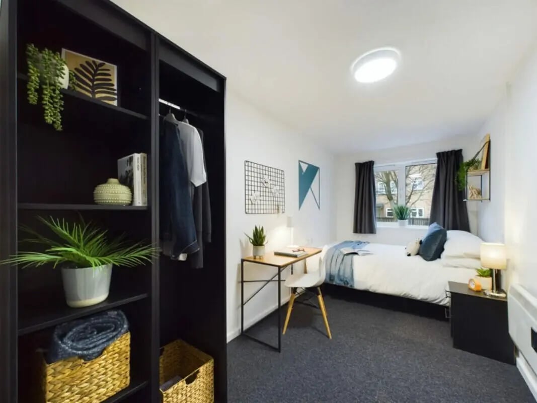 Wardrobe desk bed and plants bedroom at 4 Bedroom House at 17, Brookside in Derby Student Accommodation