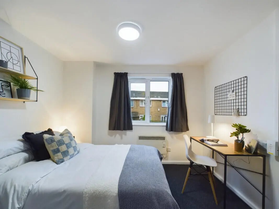 Bed desk chair plants shelves bedroom at 3 Bedroom House at 20, Brookside in Derby Student Accommodation