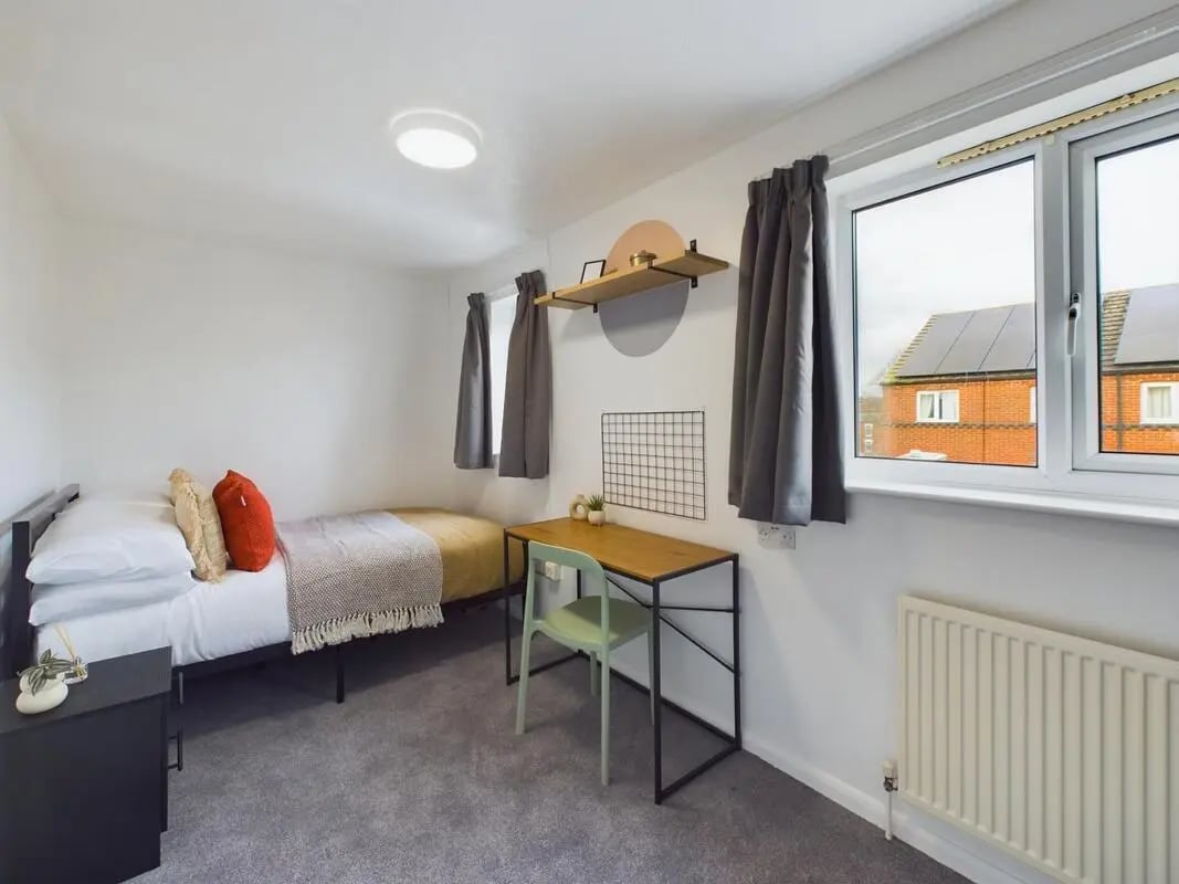 Bed desk chair window and radiator bedroom at 6 Bedroom House at 3, Mint Road in Leicester Student Accommodation