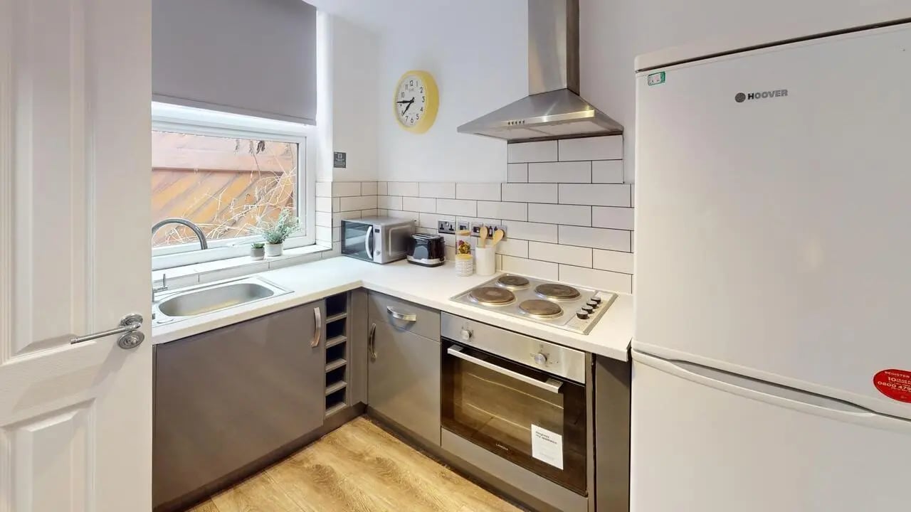 Sink microwave toaster oven fridge kitchen at 1 Bedroom House at Flat 3, 265, Edge Lane in Liverpool Student Accommodation