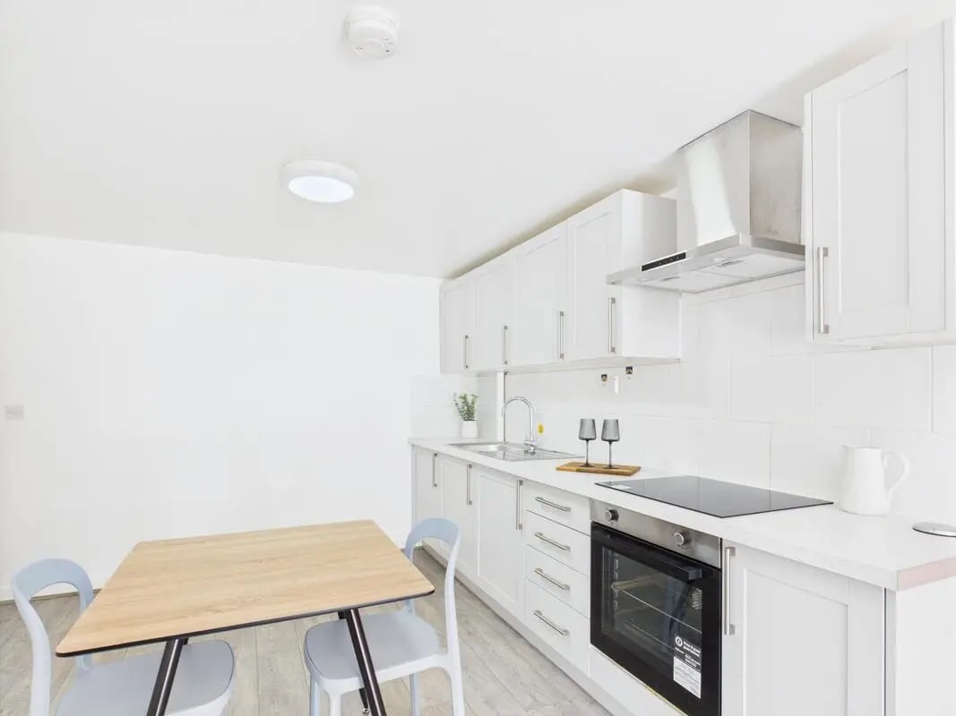 Kitchen with oven table and chairs kitchen at 1 Bedroom House at Flat 21, Grove Street Studios, The Groves in Liverpool Student Accommodation