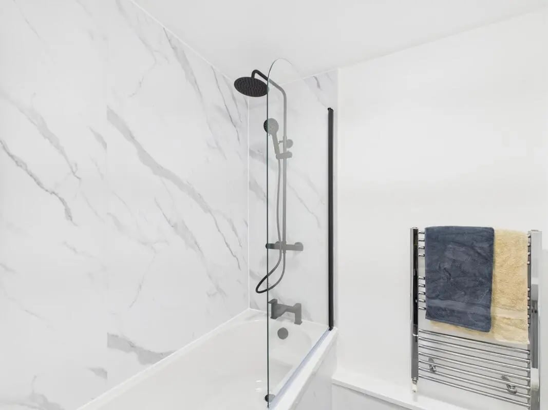 Marble shower bath heated towel rail bathroom at 1 Bedroom House at Flat 5, Grove Street Studios, The Groves in Liverpool Student Accommodation
