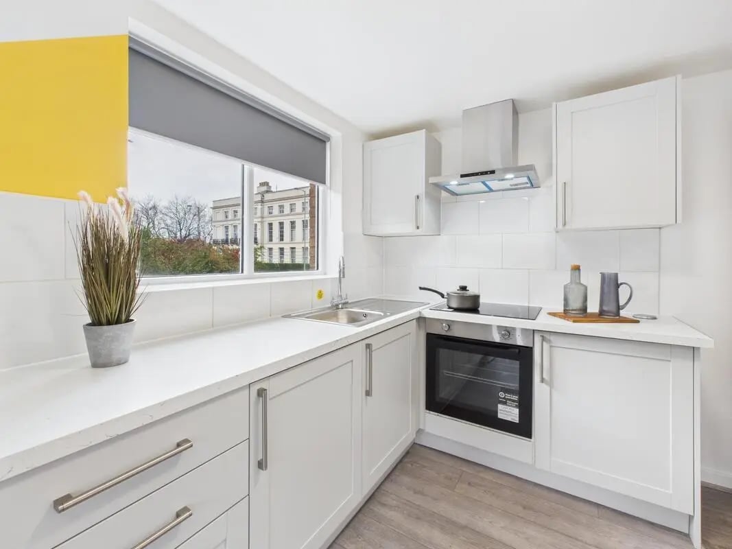 White kitchen with oven sink and cabinets kitchen at 2 Bedroom House at Flat 8, Grove Street Studios, The Groves in Liverpool Student Accommodation