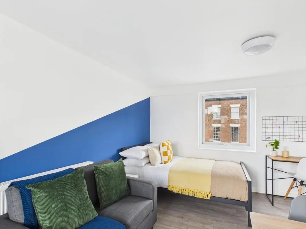 Sofa bed desk and grid wall Bedroom living area at 1 Bedroom House at Flat 25, Grove Street Studios, The Groves in Liverpool Student Accommodation