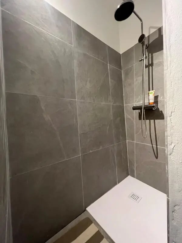 Modern tiled shower with white tray and showerhead Bathroom at Entire Apartment In Tapigliano Near Lago Maggiore in Tapigliano Student Accommodation