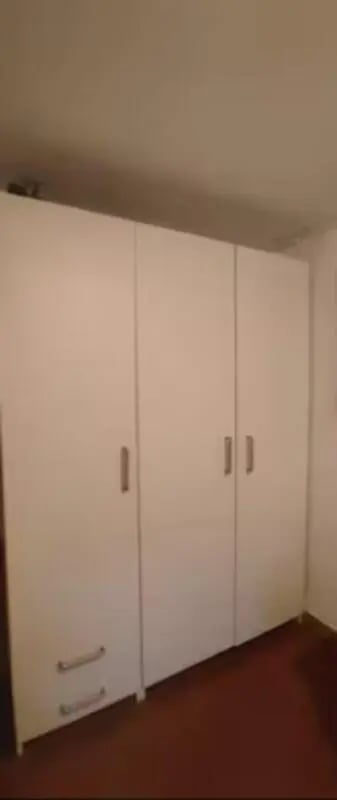 White wardrobe with drawers bedroom. at Comfy studio inside an indipendent house well connected to Università di Novara in Novara Student Accommodation