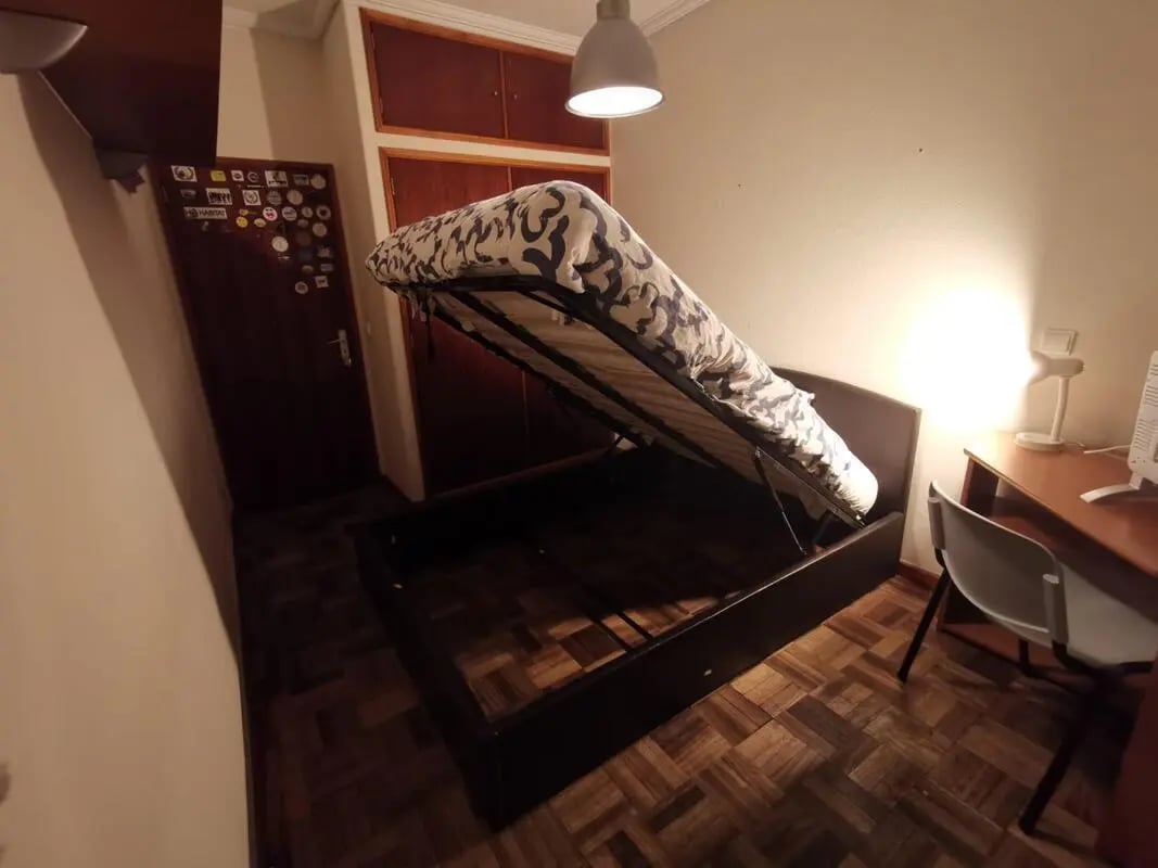 Lift-up bed frame with storage space bedroom at Double Bedroom close to Minho University 6 in Guimaraes Student Accommodation