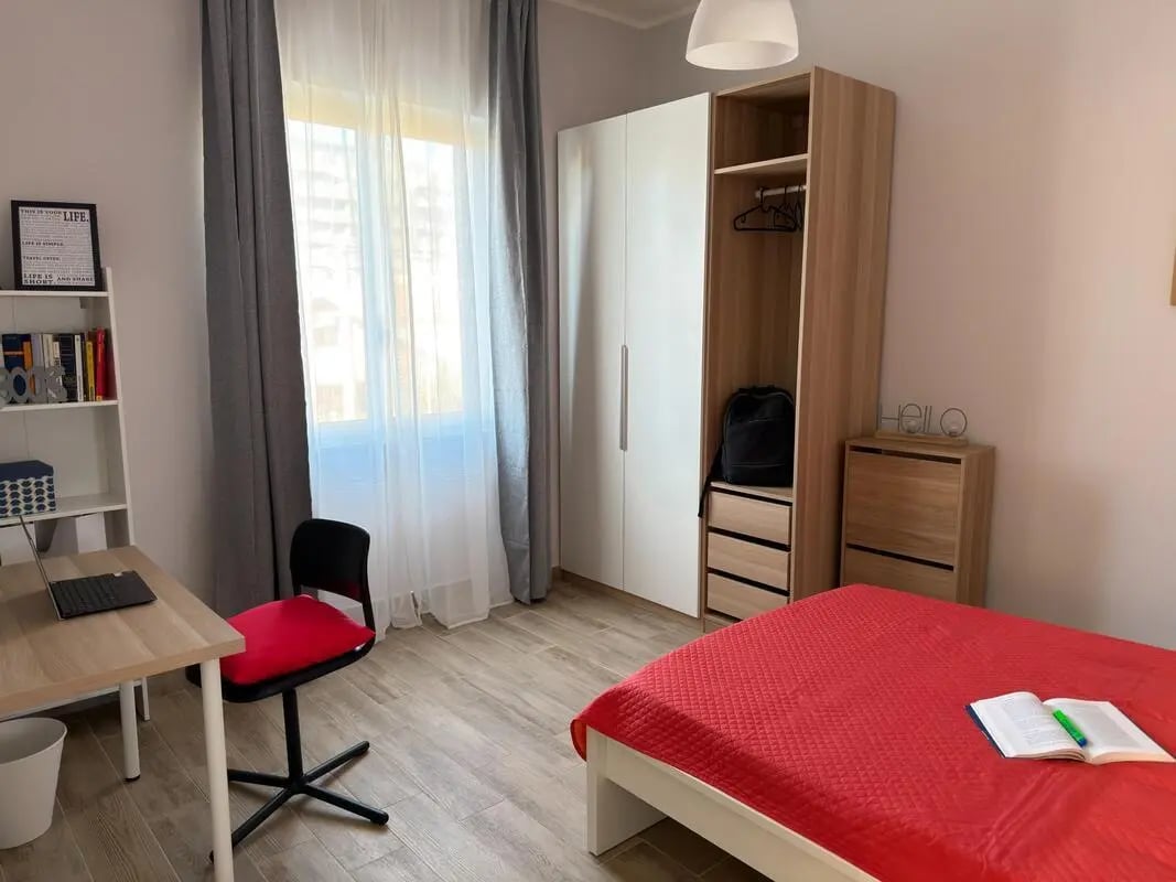 Desk chair wardrobe bed and bookshelf bedroom at Amazing bedroom in Pescara in Pescara Student Accommodation