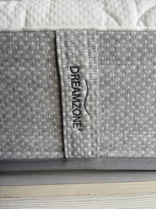 Dreamzone mattress detail with textured grey fabric Bedroom at Prime location flat with sea view balcony close to Aristotle University in Thessaloniki Student Accommodation
