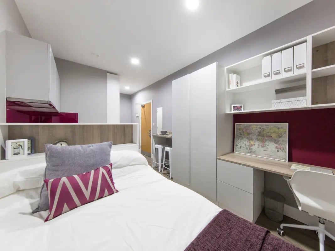 Bed desk shelves and cabinets student accommodation bedroom at AXO Kingston in Kingston Upon Thames Student Accommodation