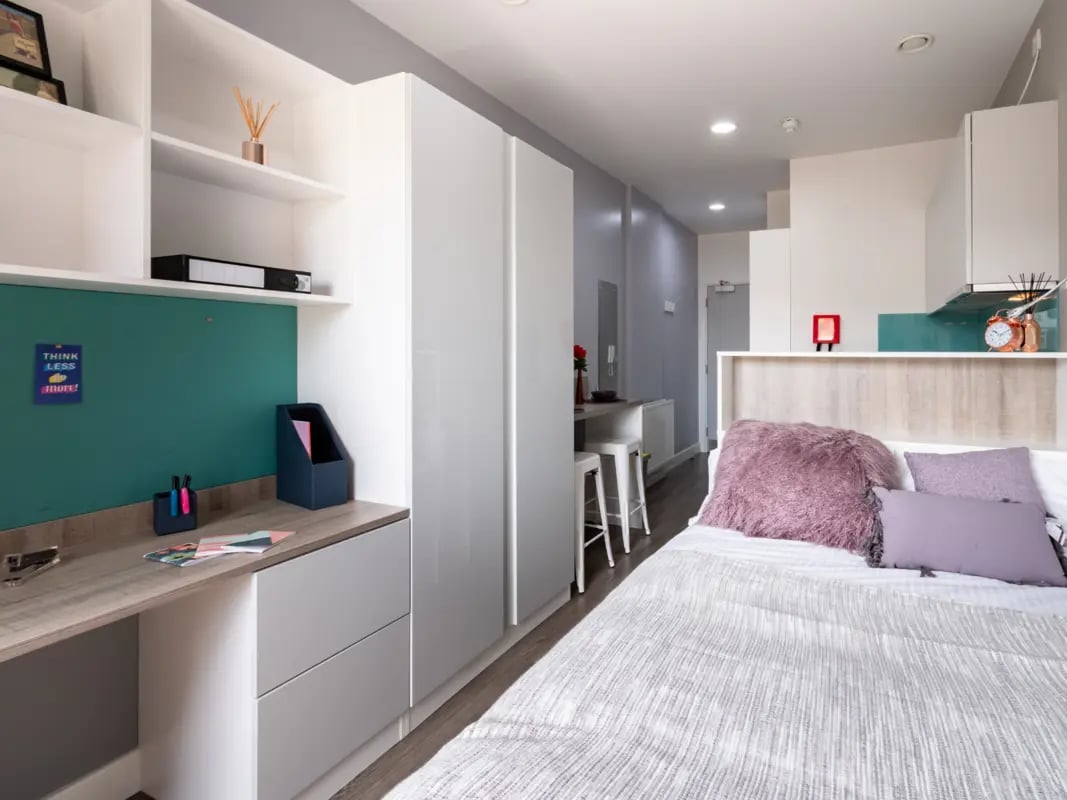 Desk shelves wardrobe bed and kitchen studio at AXO Kingston in Kingston Upon Thames Student Accommodation