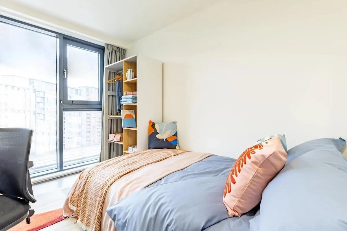 Bed with shelves chair and window Bedroom at Bridge House - Glasgow in Glasgow Student Accommodation