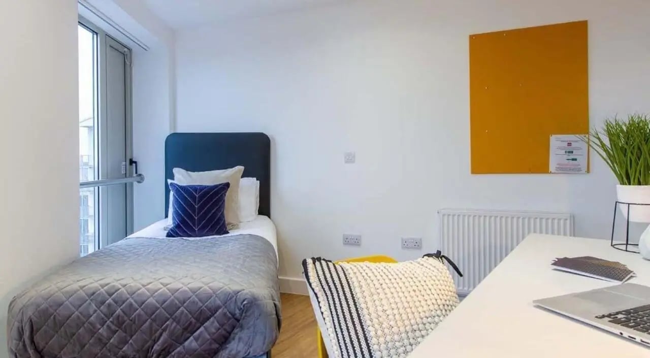 Bed desk radiator plant and corkboard bedroom at Orbital in Nottingham Student Accommodation