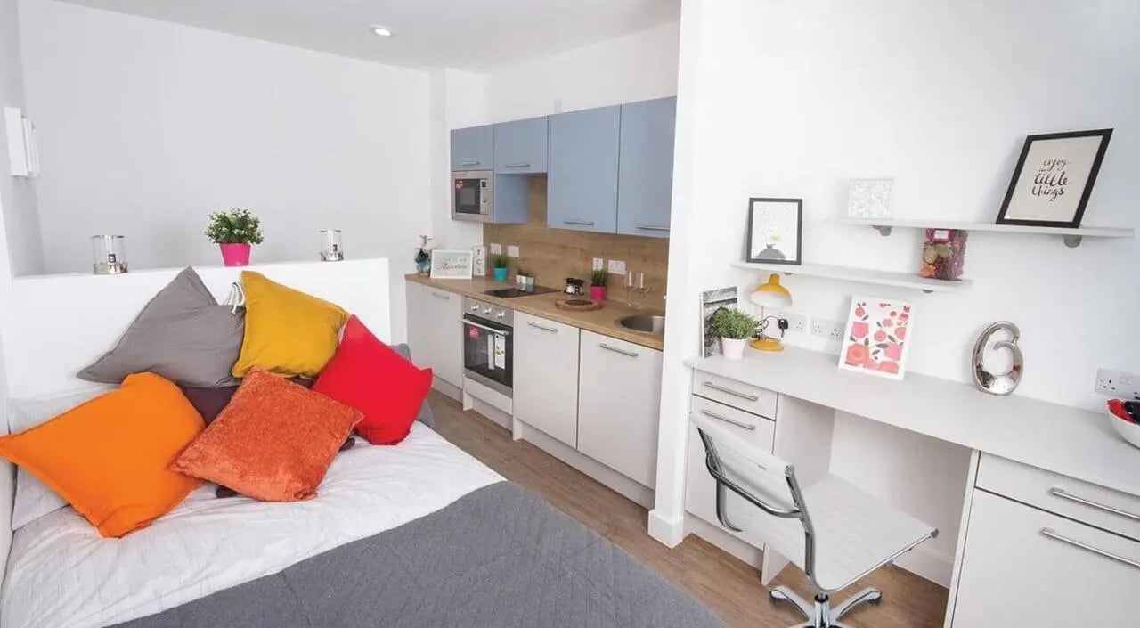 Bed kitchen desk and chair student studio apartment at Orbital in Nottingham Student Accommodation