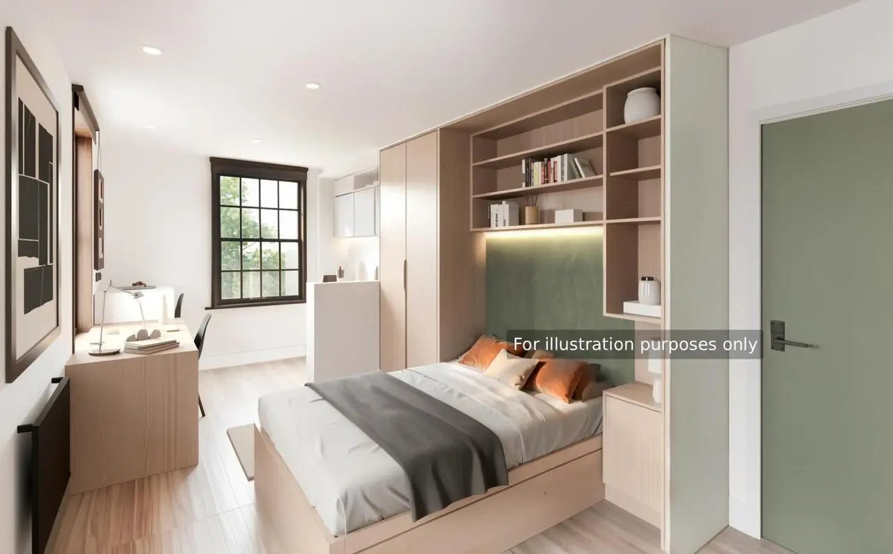 Bed desk bookshelf wardrobe and door bedroom at Halsmere Studios in London Student Accommodation