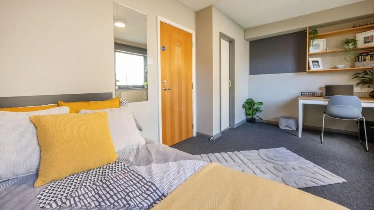 Bed desk chair mirror student room at Clarence Dock Village in Leeds Student Accommodation