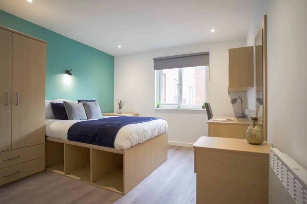 Bed wardrobe desk and storage unit bedroom at Park View in Manchester Student Accommodation