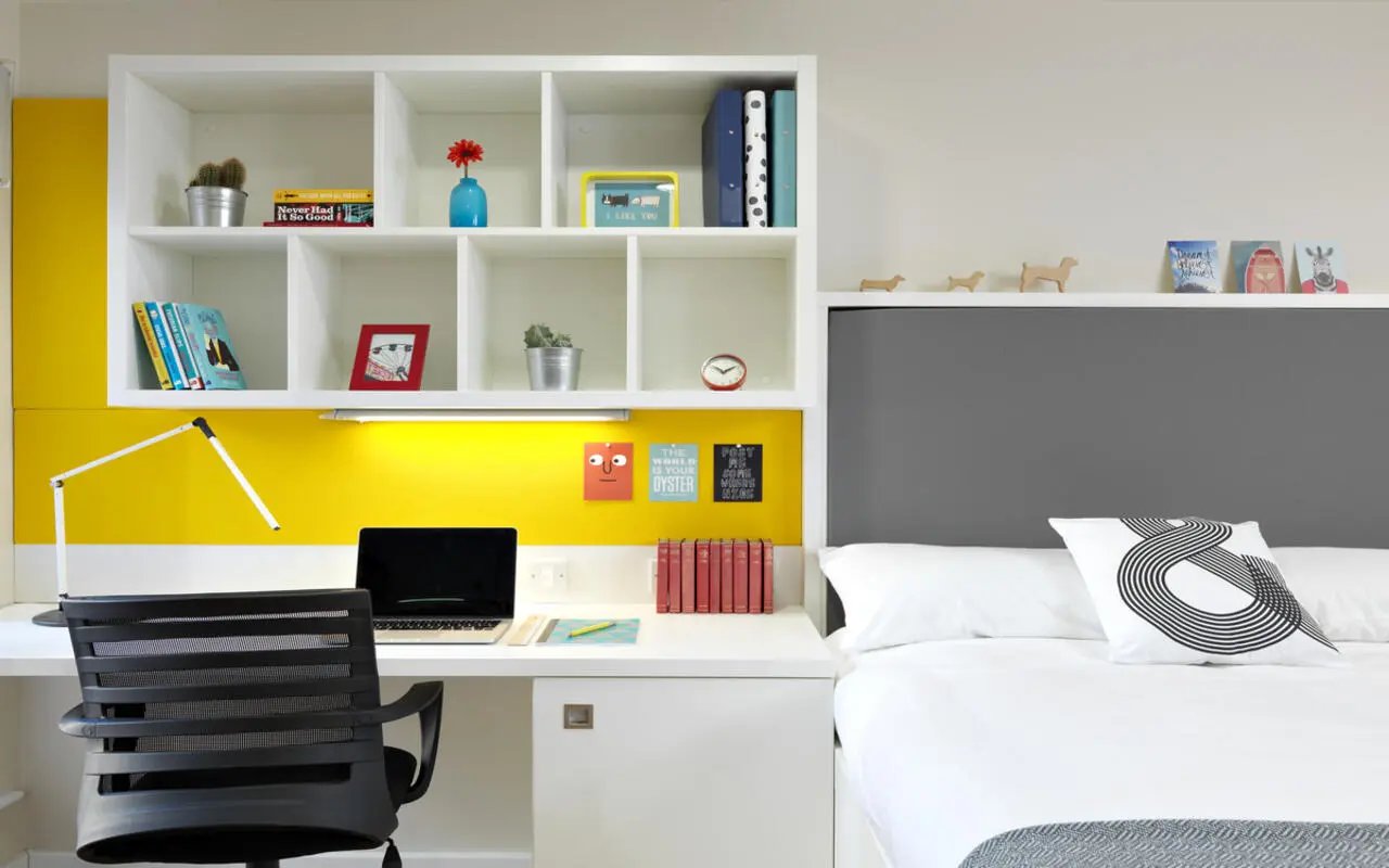 Desk chair laptop books shelves bed Bedroom at Student Castle York in York Student Accommodation