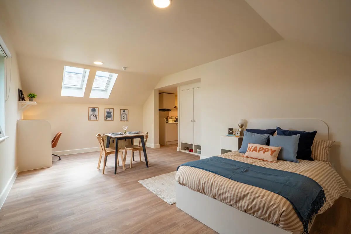 Bed desk table skylights wardrobe kitchen bedroom at Valerian in York Student Accommodation