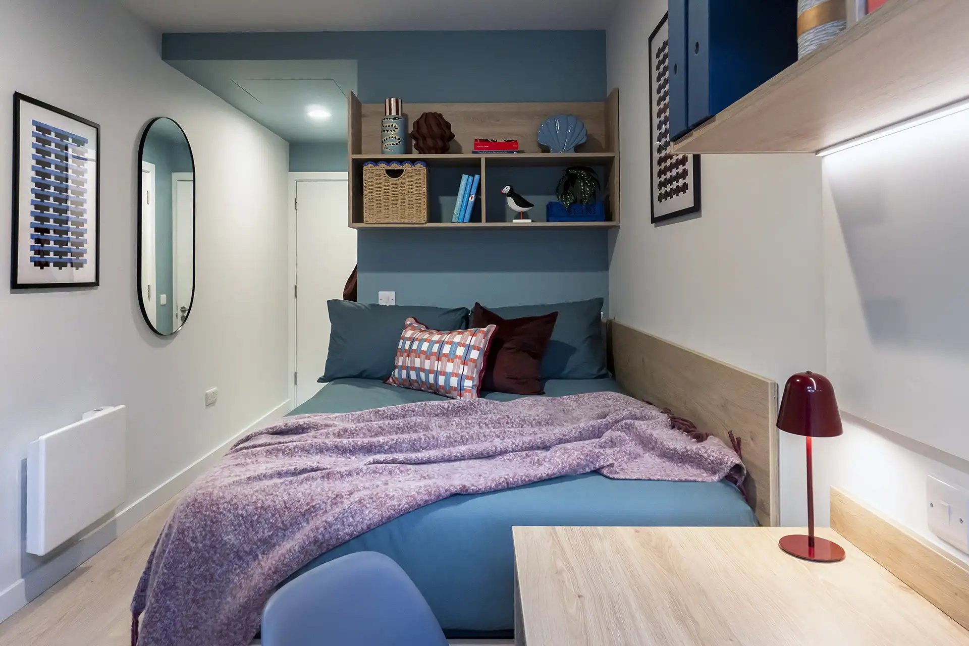 Bed with teal bedding and pink throw bedroom at Queen Street Place in Galway Student Accommodation