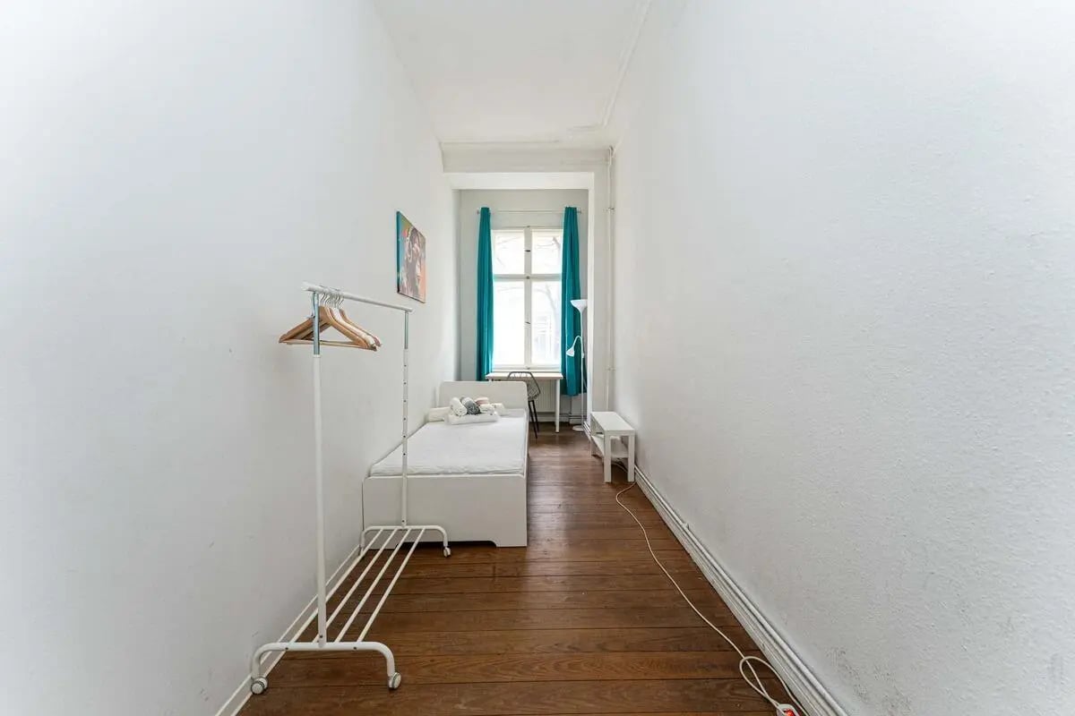 White bed clothing rack picture window bedroom at Gabriel-Max-Straße - Room 4 in Berlin Student Accommodation