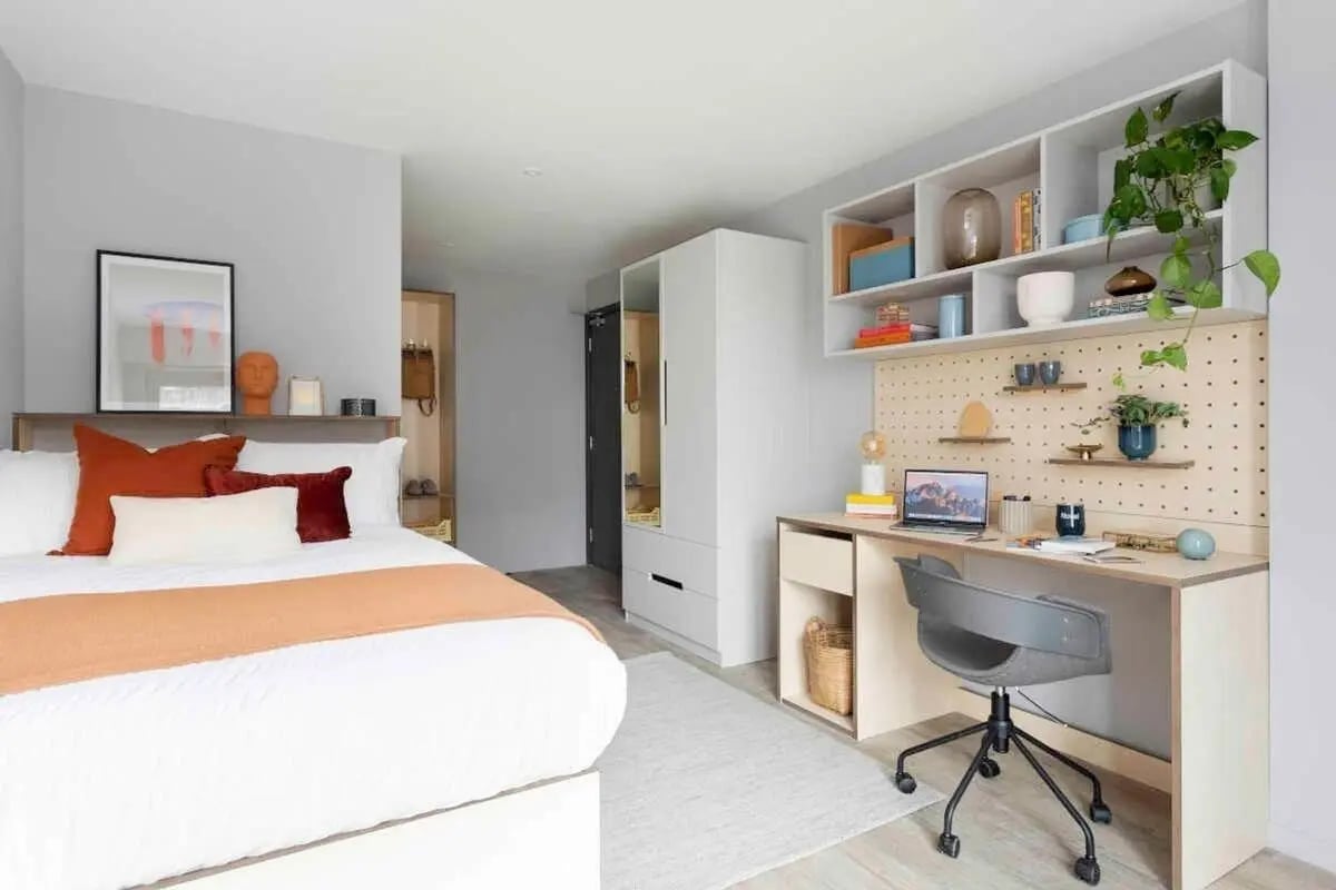 Bed with desk and shelving study area at Bridle Works Glasgow in Glasgow Student Accommodation