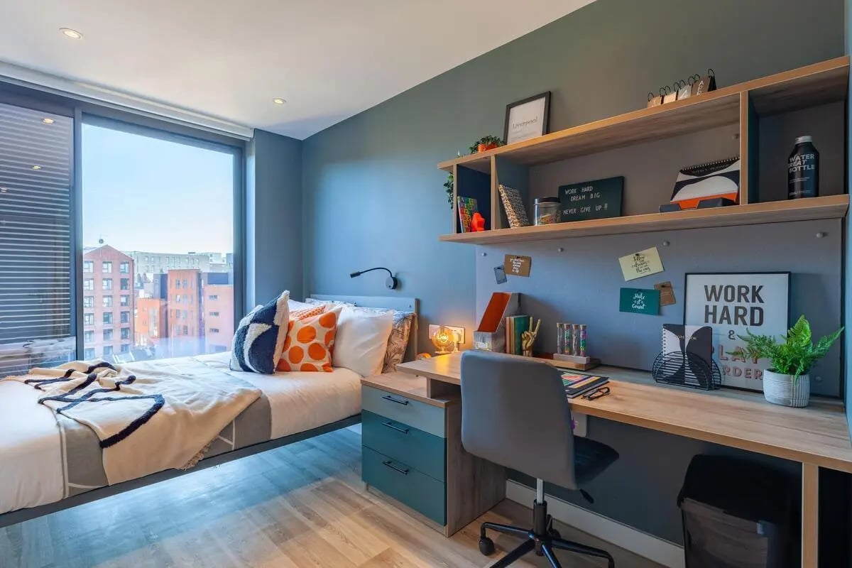 Bed with desk and shelves student room at Benson Yard in Liverpool Student Accommodation