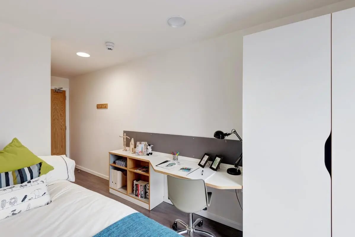 Bed desk chair wardrobe bedroom at Dunaskin Mill in Glasgow Student Accommodation
