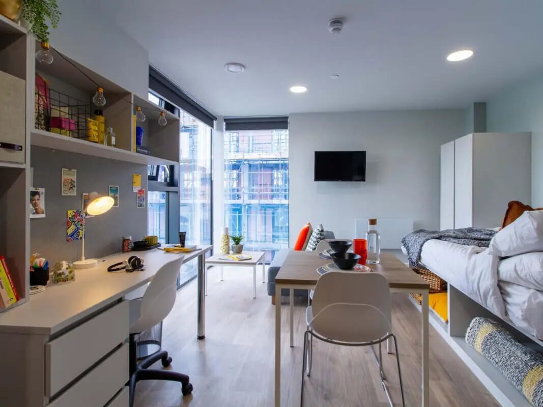 Desk chair bed table television studio apartment at The Refinery in Leeds Student Accommodation