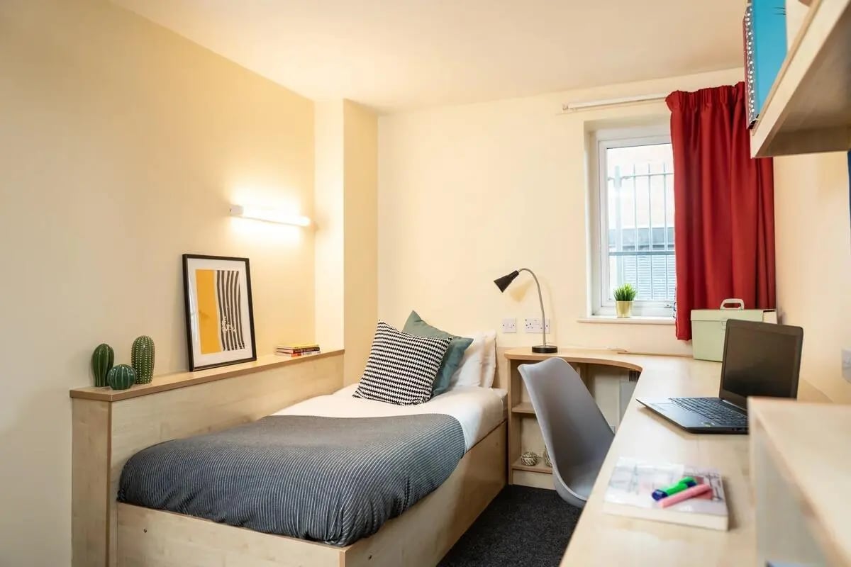 Bed desk laptop and chair student bedroom at Albert Court in Liverpool Student Accommodation