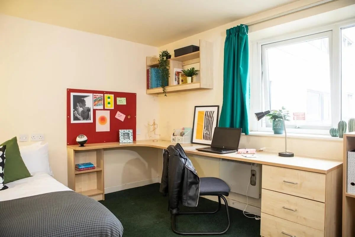 Bed desk shelf and chair student room at Albert Court in Liverpool Student Accommodation