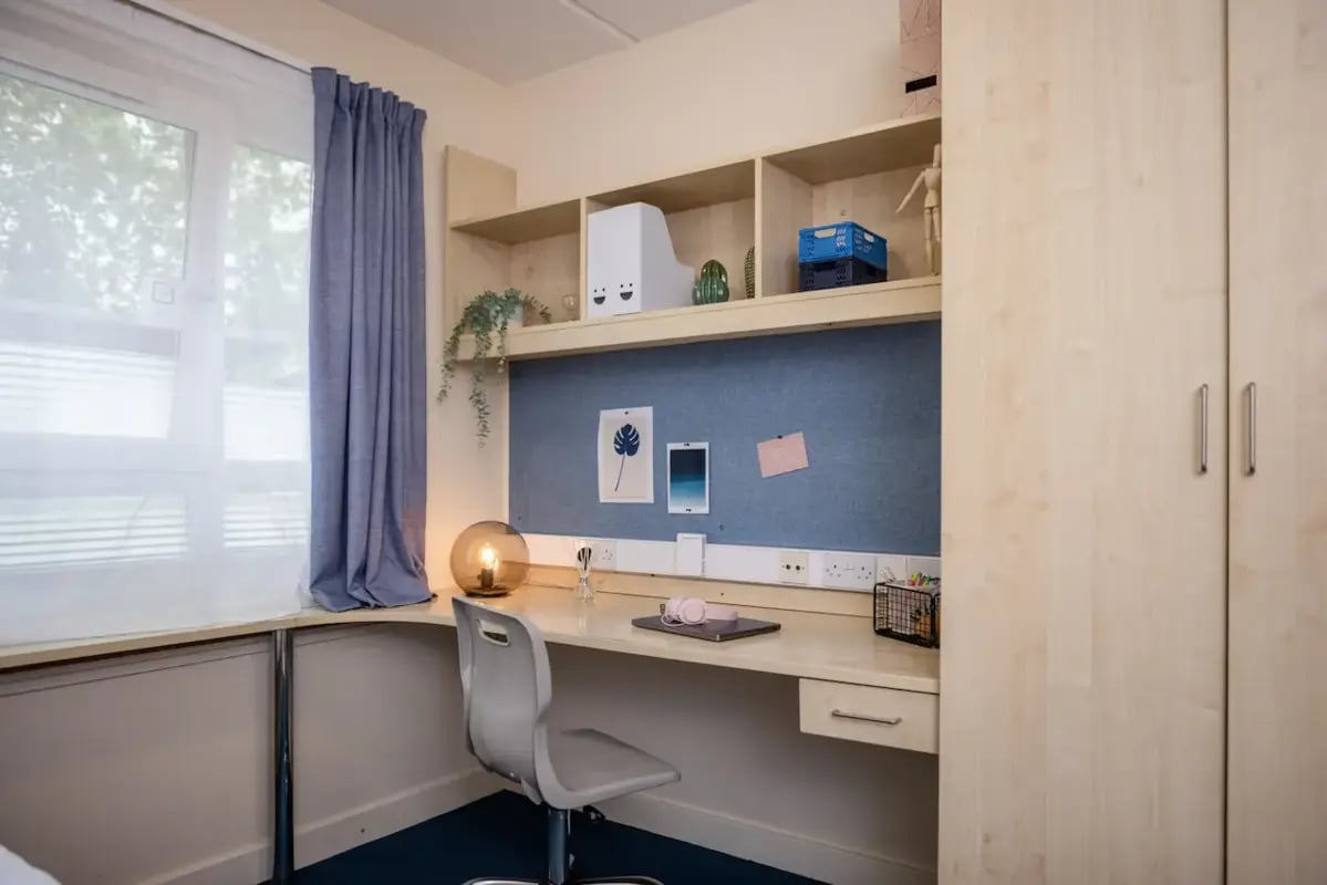 Desk with chair and shelves Bedroom at Mcmillan student Village in Greenwich Student Accommodation