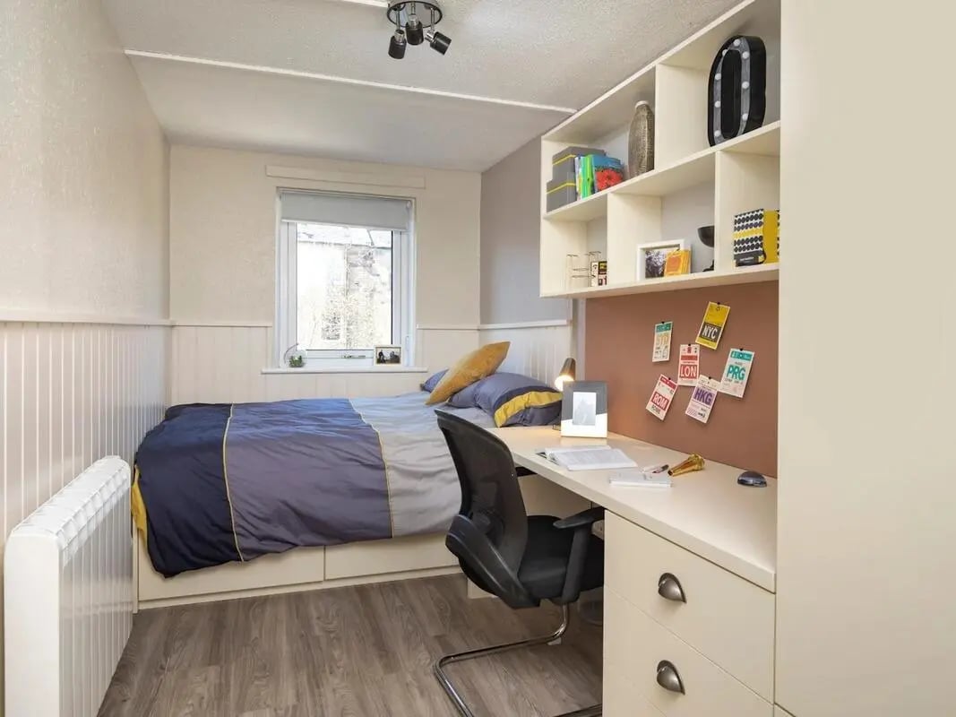 Bed desk shelving and chair student bedroom at Meadow Court in Edinburgh Student Accommodation