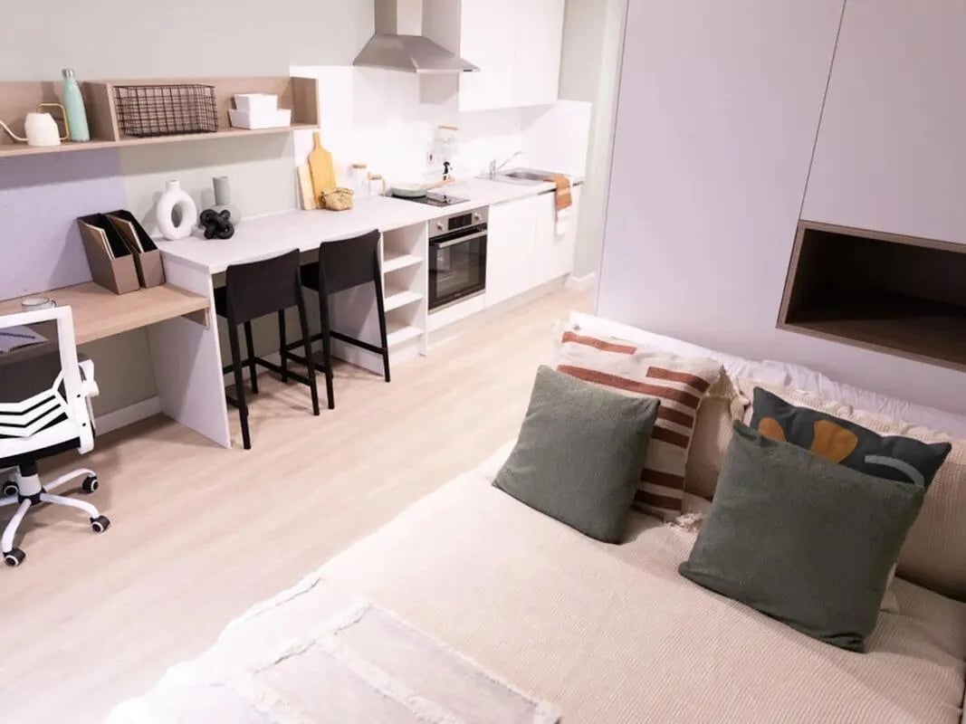 Bed desk kitchen with stools and chair Studio at Norton's Student Living in Edinburgh Student Accommodation