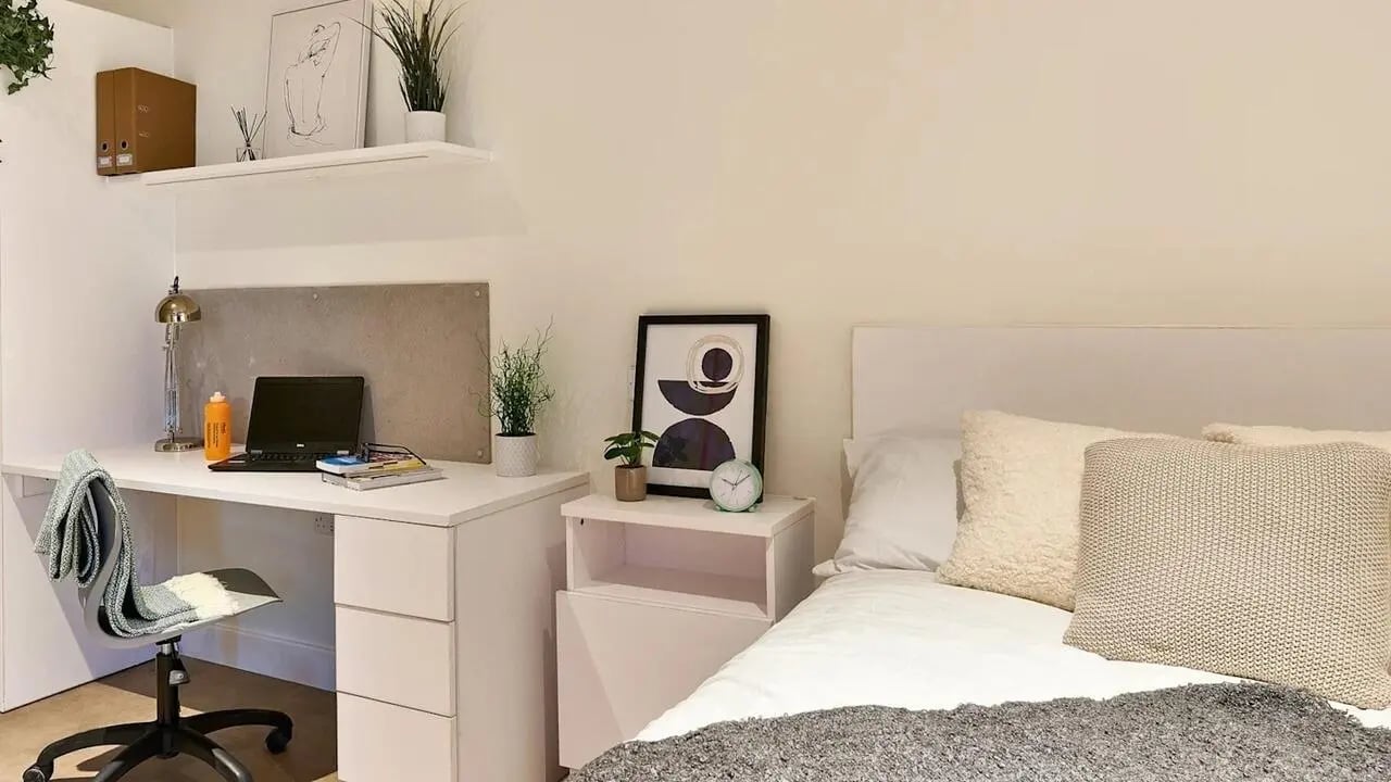 Desk laptop chair pillows and bed bedroom at View Studios in London Student Accommodation
