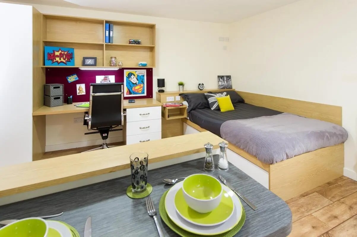 Bed desk chair and dining area bedroom at Quebec House in Kingston Upon Thames Student Accommodation