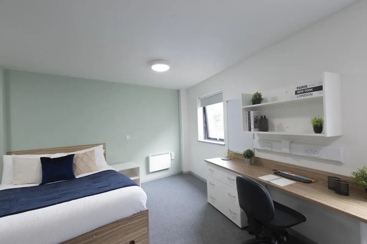 Bed desk chair and shelving student bedroom at Rosedale Court in Newcastle Upon Tyne Student Accommodation