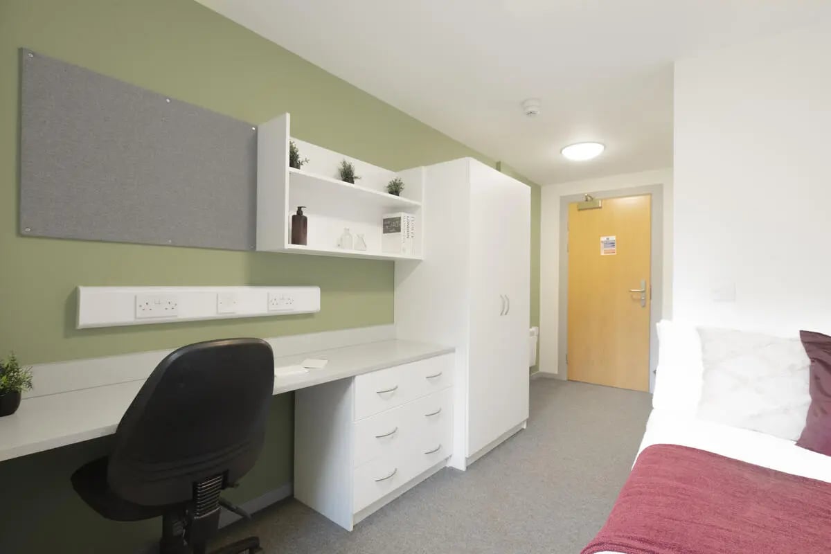 Desk chair whiteboard shelves wardrobe bed bedroom at Newton Court in Newcastle Upon Tyne Student Accommodation