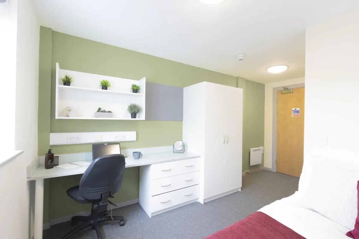 Desk chair wardrobe and shelving unit bedroom at Bryson Court in Newcastle Upon Tyne Student Accommodation