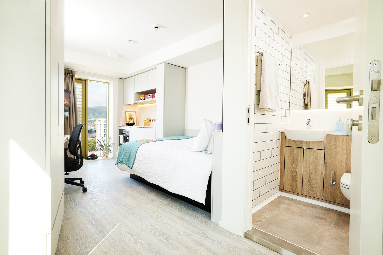 Bed desk kitchen and bathroom Bedroom at Vita Student Bruce Street in Belfast Student Accommodation