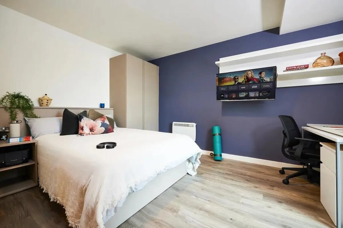 Bed desk TV and closet bedroom at Vita Student Newcastle Westgate in Newcastle Upon Tyne Student Accommodation