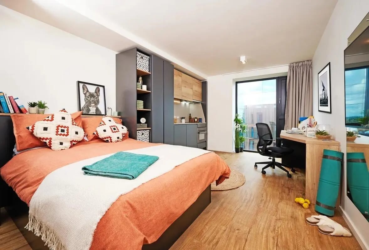 Bed desk shelves kitchen and window studio apartment at Vita Student Copper Towers in Coventry Student Accommodation