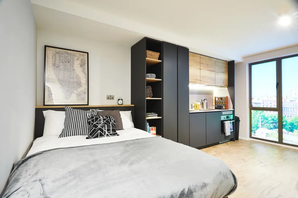 Bed kitchen area with sink and cabinets living room at Vita Student Station Street in Nottingham Student Accommodation