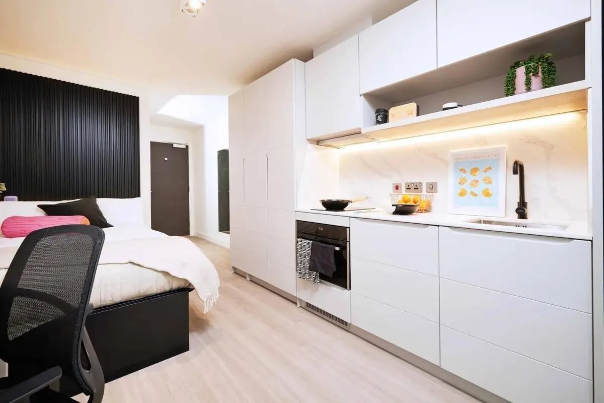Bed kitchen area with sink and oven Studio. at Vita Student Iona Street in Edinburgh Student Accommodation