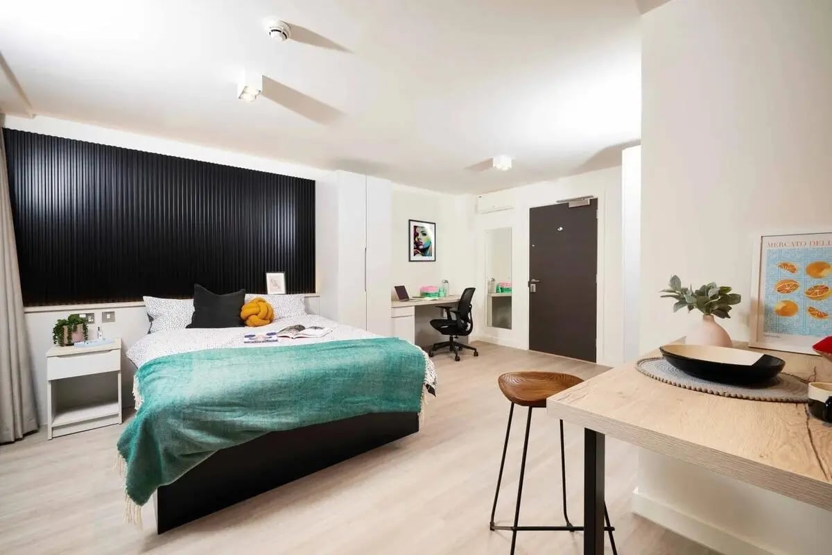 Bed desk chair and table student studio. at Vita Student Iona Street in Edinburgh Student Accommodation