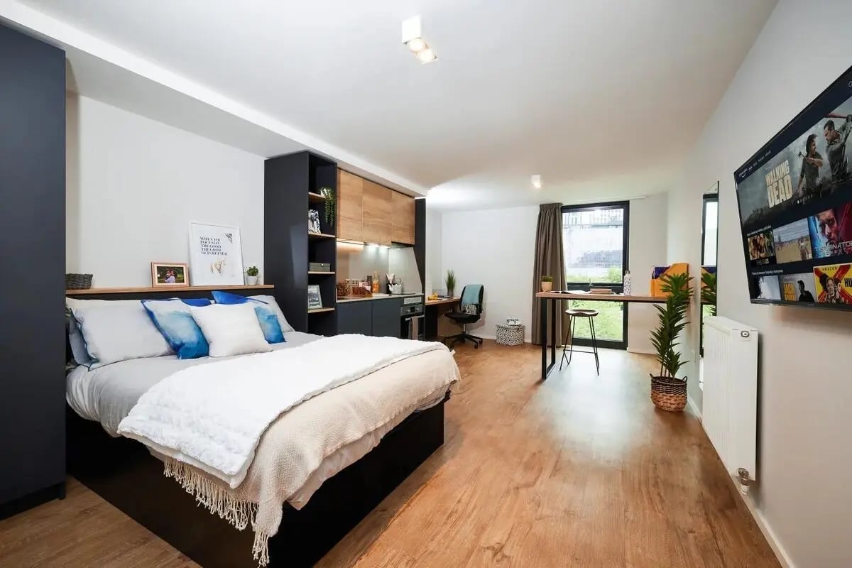 Bed kitchen study desk and TV studio apartment at Vita Student Portland Crescent in Leeds Student Accommodation