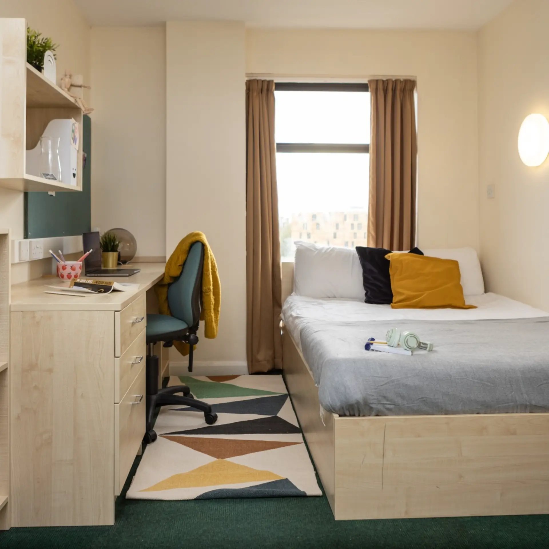 Desk bed chair with yellow sweater bedroom at Newport Student Village in Newport Student Accommodation