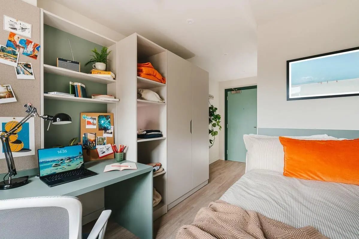 Desk laptop shelves bed and artwork bedroom at City Wharf in Glasgow Student Accommodation