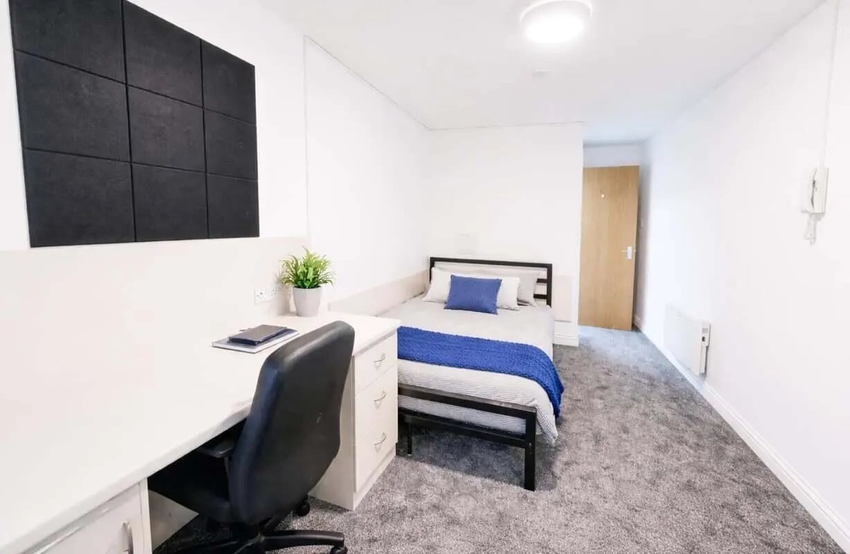 Desk bed and plant in student bedroom at Truro Works in Sheffield Student Accommodation