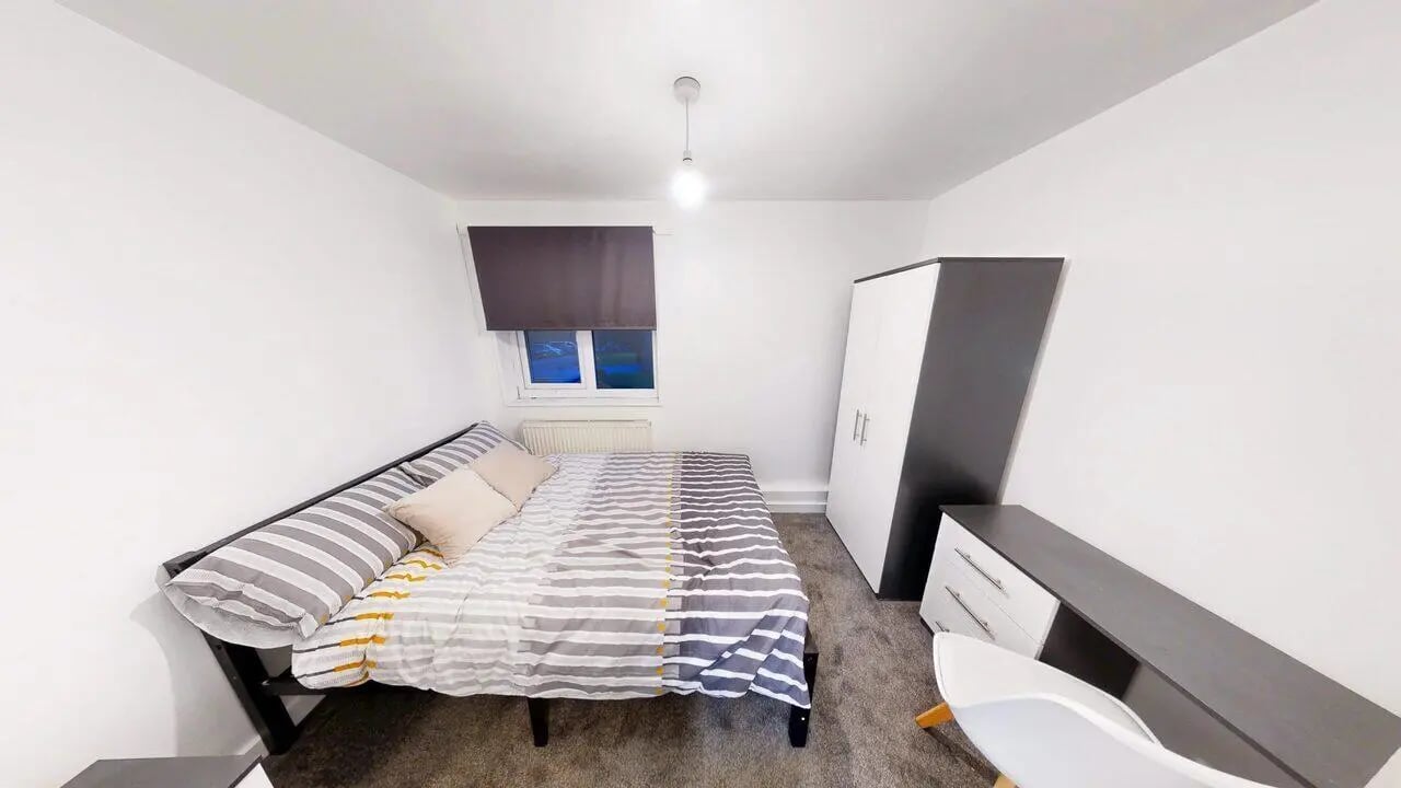 Bed wardrobe desk chair bedroom at Park Village in Sheffield Student Accommodation